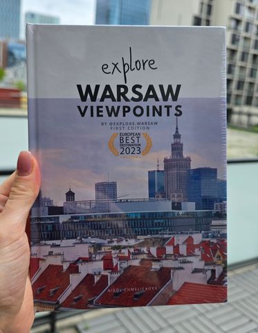 The hardcover held up against the Warsaw skyline