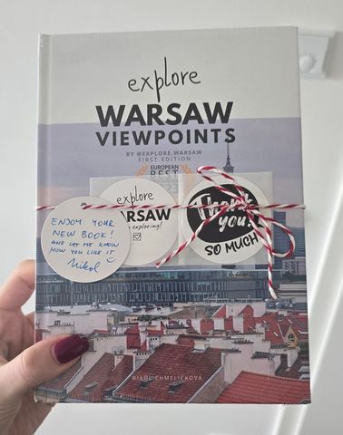 The book wrapped with a handwritten tag and thank-you stickers